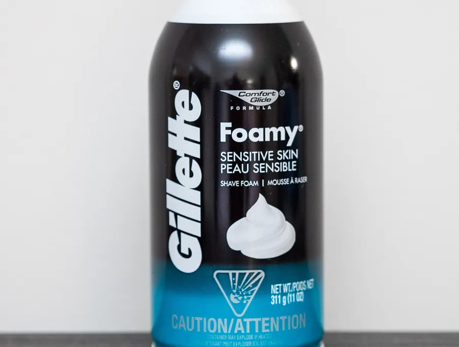 Can of Gillette Foamy sensitive skin shave foam standing on a counter.