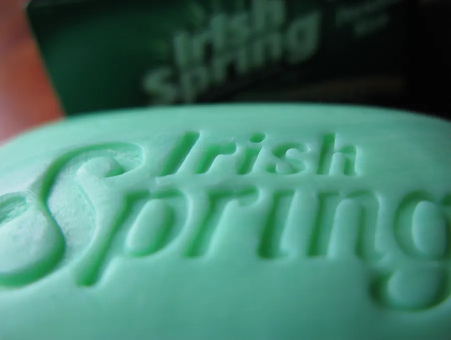 Close-up of an Irish Spring bar soap with the brand name embossed into the surface.